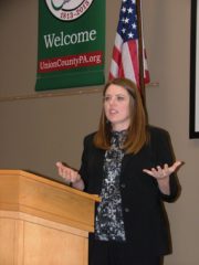Noelle Long, SEDA-COG Export Development program, makes a point during an announcement about a new manufacturing initiative.